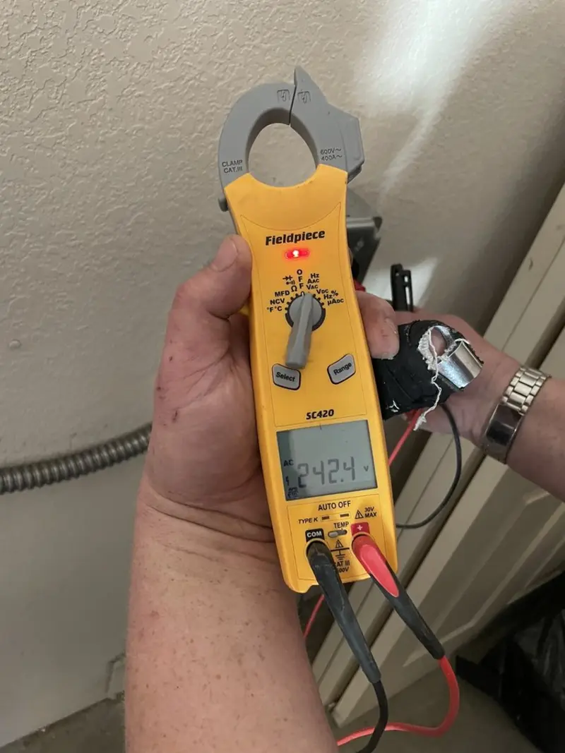 Voltage testing with clamp meter during Ceiling Fan Installation in Southaven